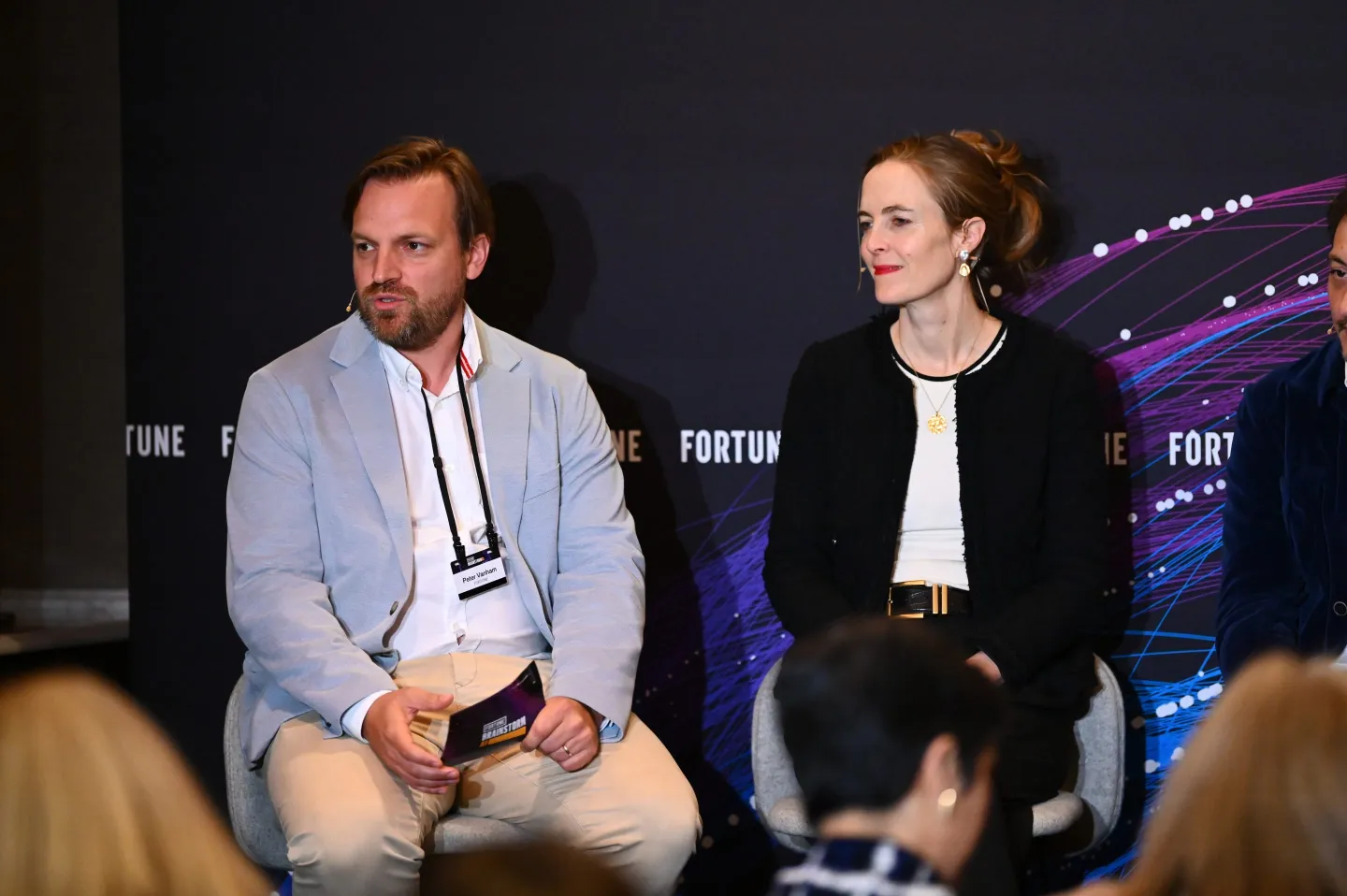 peter vanham and robyn scott sitting at a panel