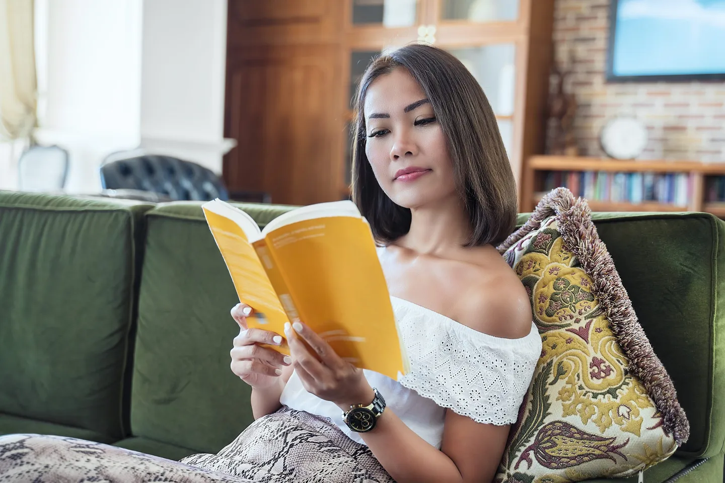 Rich woman reading book.