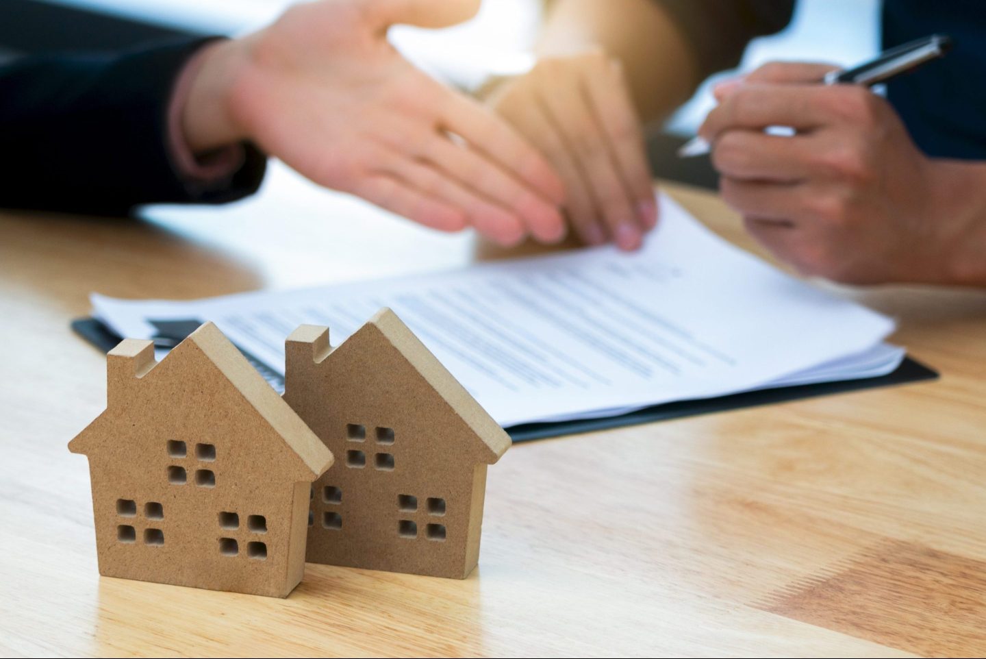 Customer signing a real estate contract in real estate agency.Concept mortgage,home purchase contract.