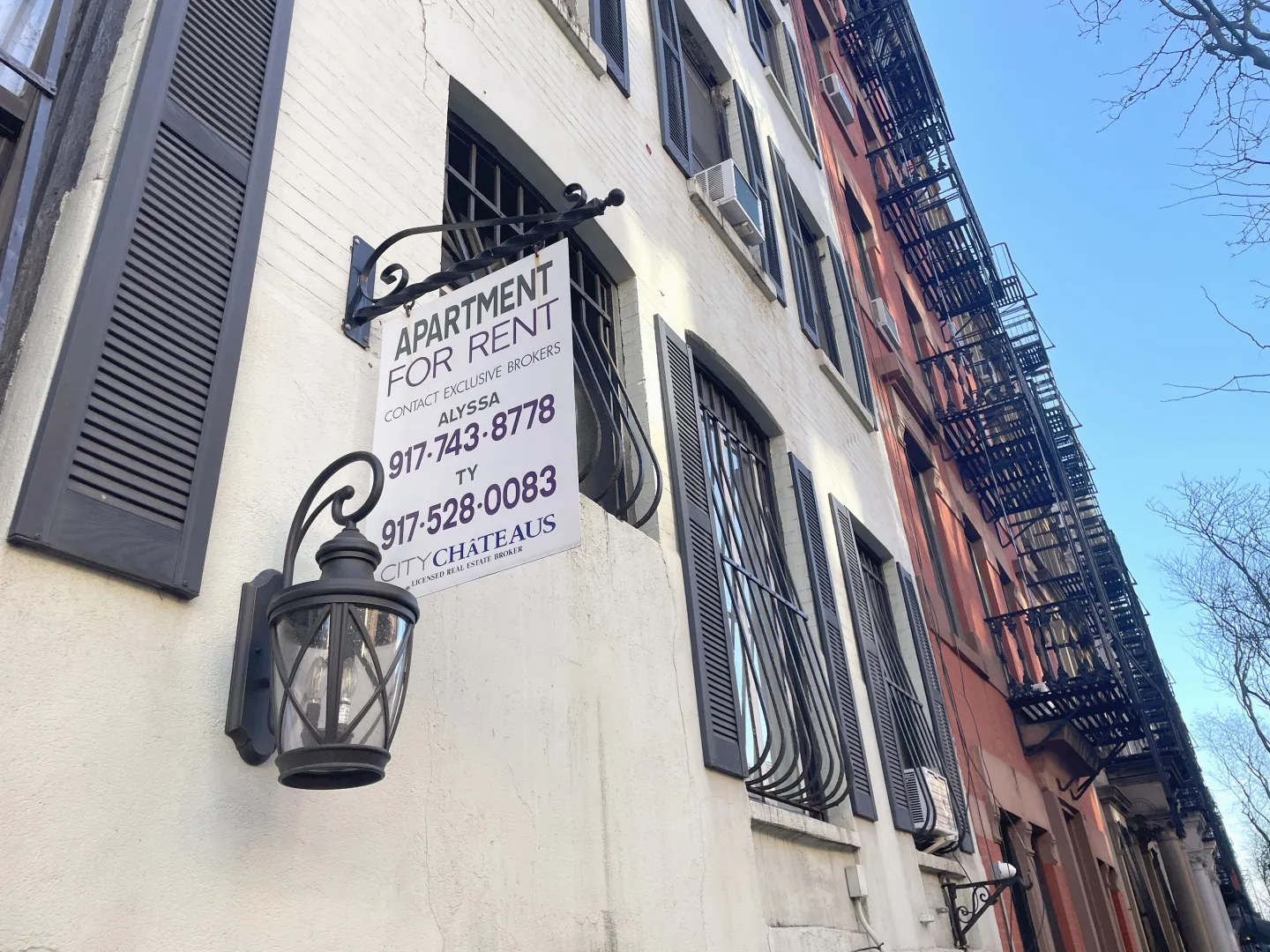 A 'For Rent' sign on a Hell's Kitchen, New York City apartment building