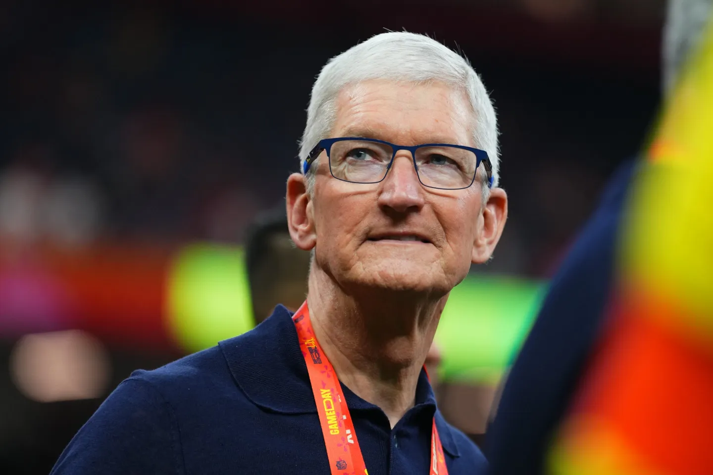 Apple CEO Tim Cook is pictured from the chest up while on the field at the Super Bowl.