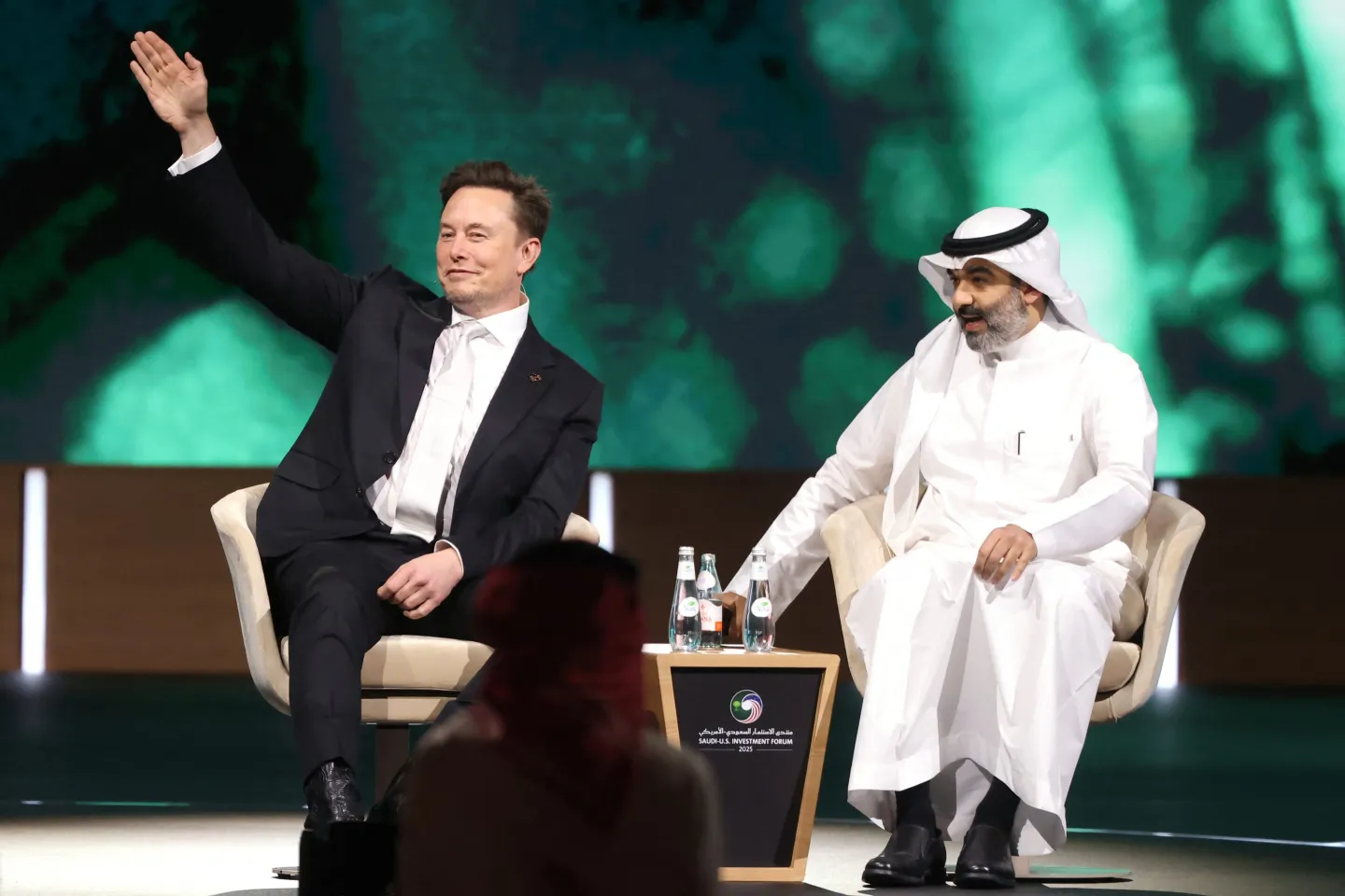 Elon Musk waves
