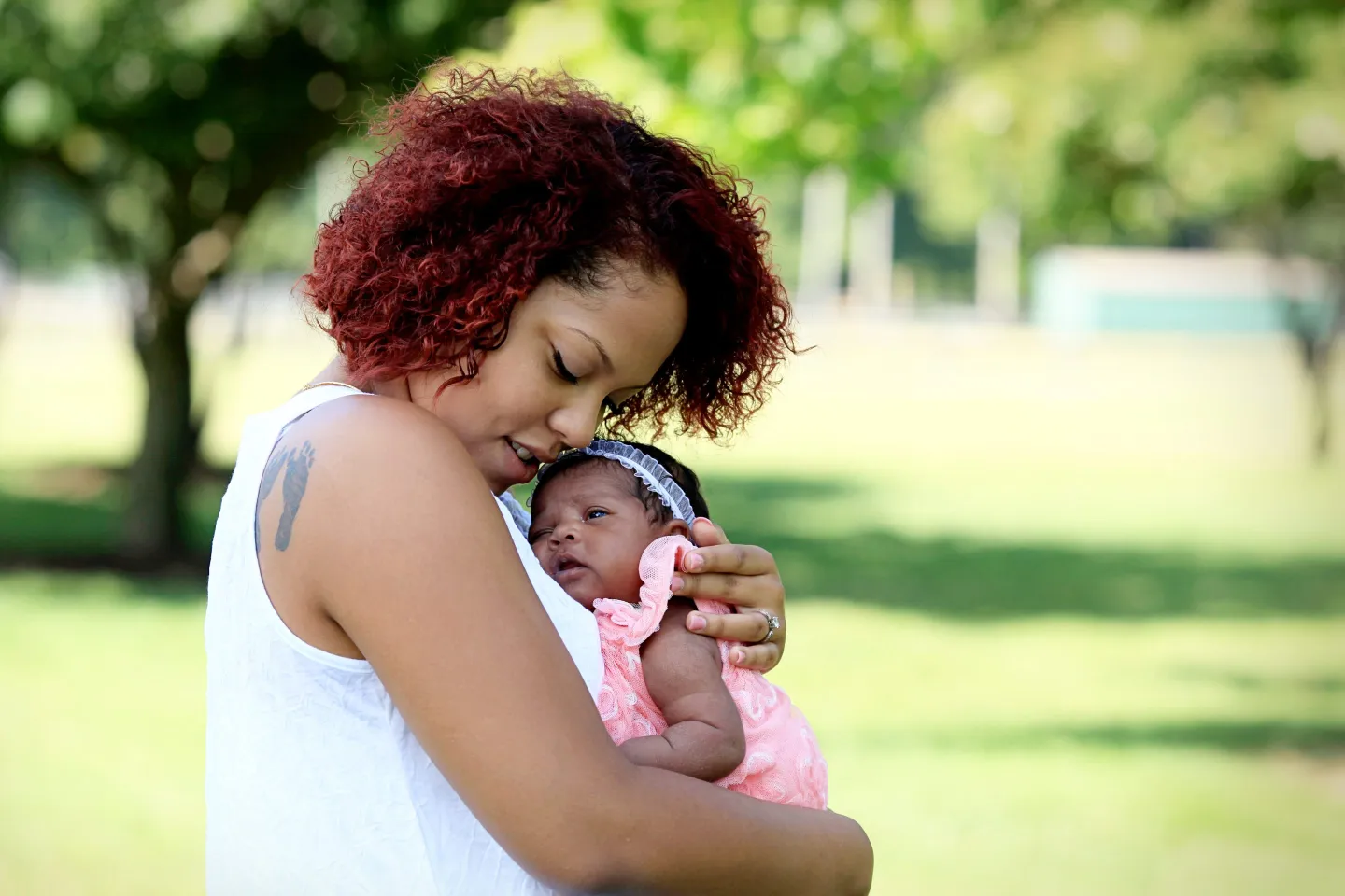 Young mom holding baby
