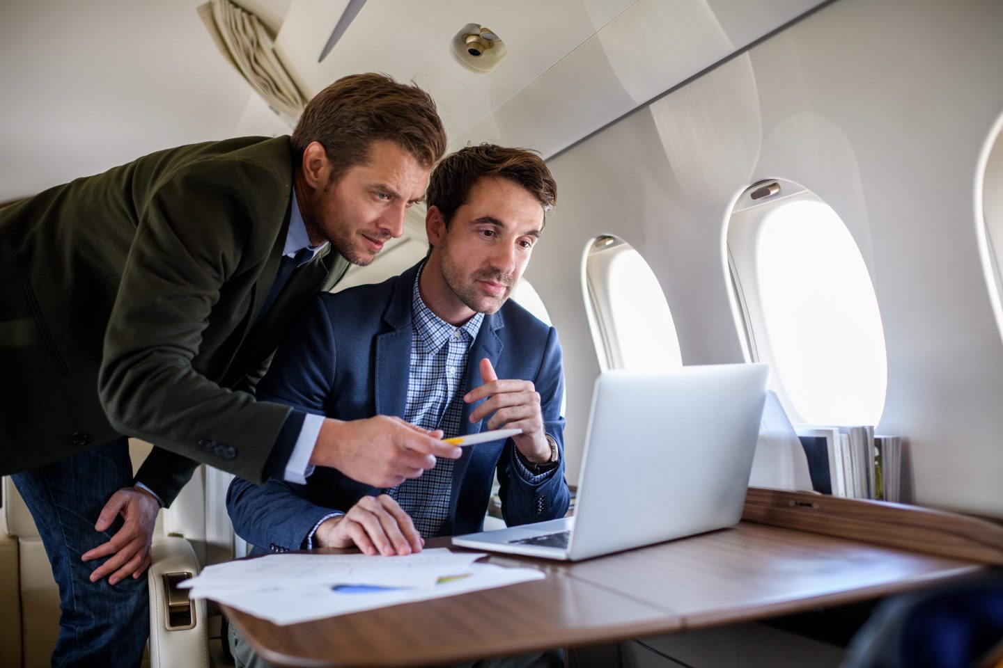 Two business people on a private jet