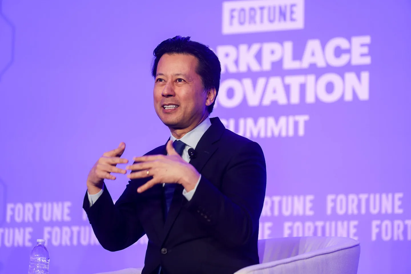 Legal scholar Kenji Yoshino speaks on stage
